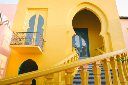 Colorful facade of building. Colorful wall, window and ladder in Thailand. Concept for background, interior, exterior, vintage house style, buildingの写真素材