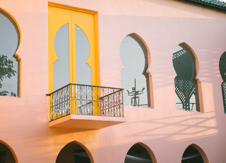 Colorful facade of building. Colorful wall, window and ladder in Thailand. Concept for background, interior, exterior, vintage house style, buildingの写真素材