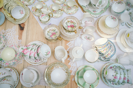 Antique porcelain pastel tea cup on wooden tableの写真素材