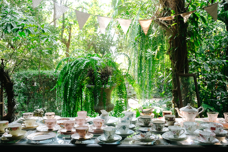 Antique porcelain pastel tea cup on wooden tableの写真素材
