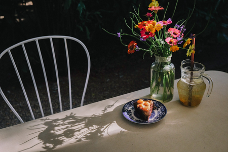 homemade macadamia cake. very sweet chocolate cake topping with caramel sauce and macadamia nuts.の写真素材