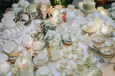 Antique porcelain pastel tea cup on wooden tableの写真素材