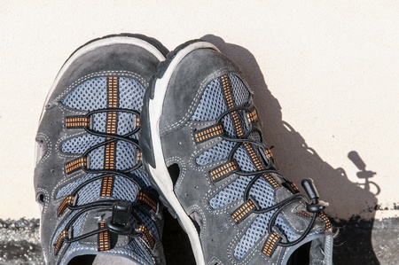 Pair of shoes tracking at sun