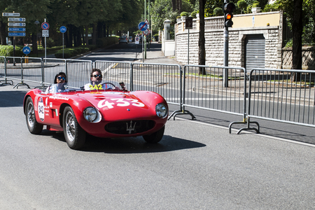 Unidentified drivers on a vintage race car Maserati at the start of the Italian race Mille Miglia, May 15, 2014 in Brescia  BS , Italyのeditorial素材