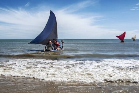 FORTALEZA, CEARA STATE, BRAZIL - JUN 29: People on small fishing boats in the sea on June 29 2010, in Fortaleza, Ceara State, Brazilのeditorial素材