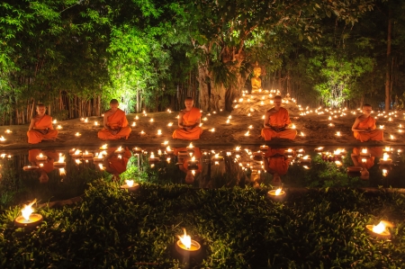 CHIANG MAI THAILAND - NOVEMBER 28  Group of monks sitting meditation in the sacred ritual at Wat Phan Tao temple in Loy Krathong and Yi Peng Festival on November 28, 2012 in Chiangmai,Thailand  のeditorial素材