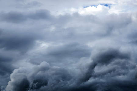Dark grey rain clouds  Dramatic sky  の写真素材
