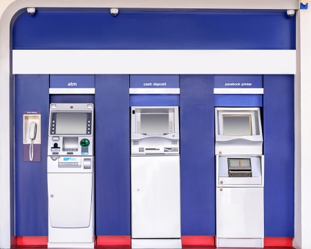Automatic banking service point on the wall outside building の写真素材