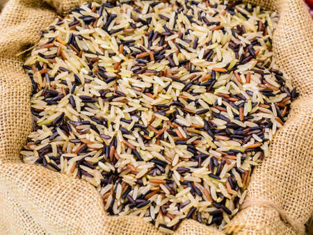 Uncooked rice in a small sack.