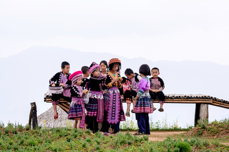 CHIANG MAI, THAILAND - OCTOBER 18 : Unidentified Hmong children wait for tourists to take pictures at Mon Cham on October 18, 2014, Chiang Mai,Thailand. Mon Cham is a tourist attraction in Chiang mai.のeditorial素材