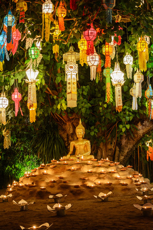 Colourful lanterns above Buddha image, Loy Krathong Festival in Phan Tao temple Chiangmai Thailand.のeditorial素材