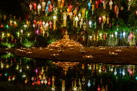 Colourful lanterns above Buddha image, Loy Krathong Festival in Phan Tao temple Chiangmai Thailand.のeditorial素材