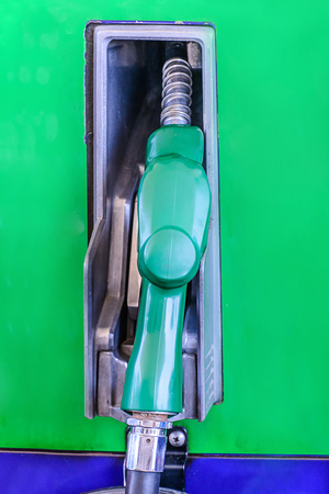 Colorful fuel oil gasoline dispenser at gas station.の写真素材