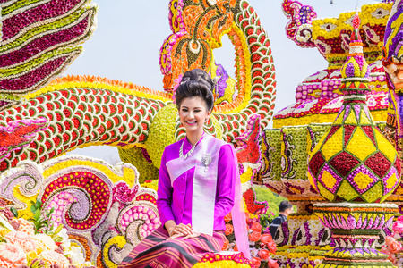 CHIANG MAI,THAILAND-FEBRUARY 07 :Unidentified peoples are in parade with fresh flowers decorate car in annual 39th Chiang Mai Flower Festival,  on February 07, 2015 in Chiang Mai,Thailand.のeditorial素材