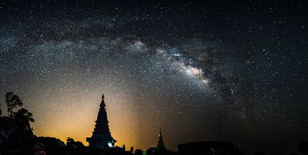 Milky Way Galaxy at Night above Pagoda silhouette in Thailand.の写真素材