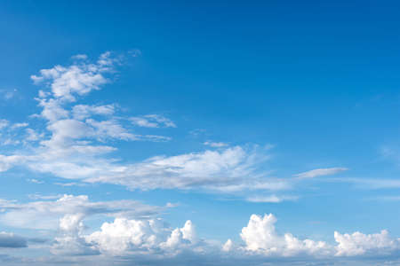 White clouds against blue sky for a background.