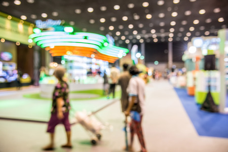 Abstract people walking in exhibition blurred defocusing background, Concept of business social gathering for meeting exchange.の写真素材
