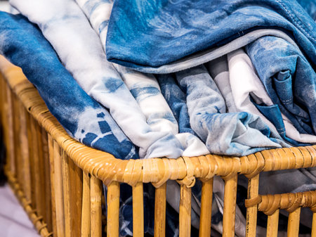 Tie dye T-shirt in wicker basket.
