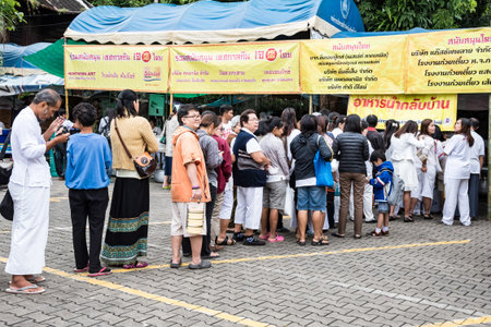 CHIANG MAI, THAILAND - OCTOBER 13: People in queue waited to be taken vegetarian food during...