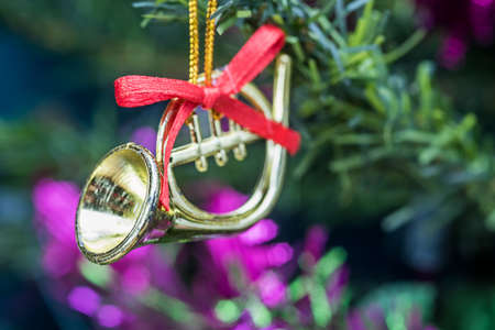 Trumpets toy decorations on christmas tree, Select the focus.の写真素材