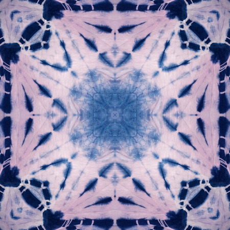 Abstract background pattern made from tie dye fabric,  kaleidoscope  pattern, endless pattern for wallpaper.の写真素材
