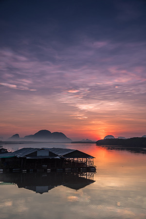 Sunrise in a small fishing village  in southern Thailand.の写真素材