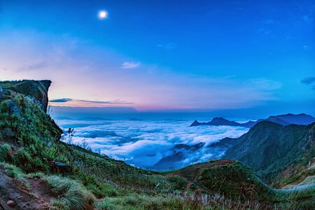 Sea of fog at Phu chi fa, Chiang rai, Thailand. Beautiful Sunrise, dramatic cloud of sea, for the sky as the background.の写真素材