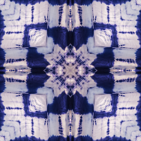Abstract kaleidoscope or endless pattern made from tie dye fabric for background used.の写真素材