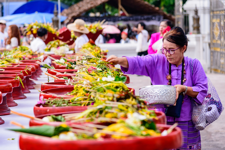 CHIANG MAI, THAILAND - MAY 22 : People worshiping offering flowers attended a ceremony to worship the city pillar (Inthakin Festival) at Chedi Luang temple on May 22, 2017 in Chiang mai, Thailand.のeditorial素材