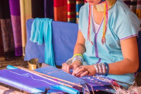 Woman Long Neck Karen Tribal Weaving of traditional in the countryside Thailand.の写真素材