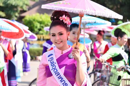 CHIANG MAI, THAILAND - JANUARY 18, 2019 : 36th anniversary Borsang umbrella festival, Women in traditional costume during the annual Umbrella festival at San Kampaeng.のeditorial素材
