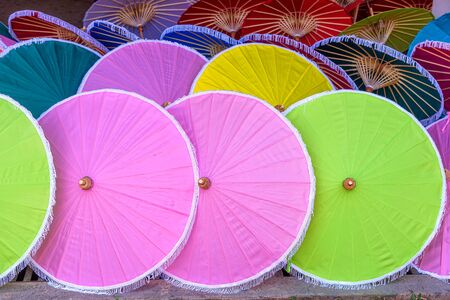 Colorful paper umbrellas handmade is traditional famous handicraft and souvenir of Chiang Mai, Thailand.の写真素材
