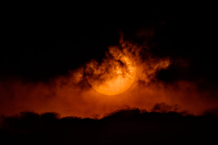 Dramatic sky orange of sun and clouds bright twilight backgrounds. Warm summer season backgrounds....