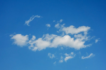 Beautiful white clouds on blue sky background. Puffy fluffy white clouds blue sky.