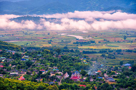 Aerial View of Tha Ton city in the valley with kok rivers, people houses and Temple Chiang Mai province Thailand. view from Tha Ton temple over the village.の写真素材
