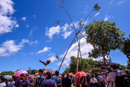 CHIANG RAI - THAILAND, SEPTEMBER 7, 2019 : Akha tribe playing with the wooden swing on Akha Swing Festival at Doi Mae Salong. The annual Akha Swing Festival is pretty much about women and fertility.のeditorial素材
