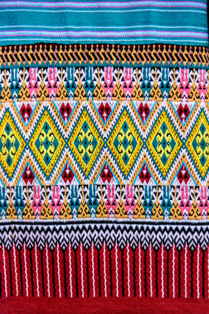 Patterns of traditional woven fabric in the Northern of Thailand. Ancient fabric colorful thai handcraft.の写真素材
