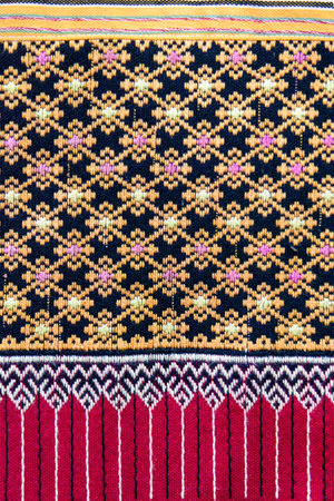 Patterns of traditional woven fabric in the Northern of Thailand. Ancient fabric colorful thai handcraft.の写真素材