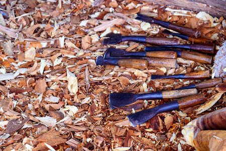 Wood carving tools arranged in an unorderly manner, carving wood in Thailandの写真素材