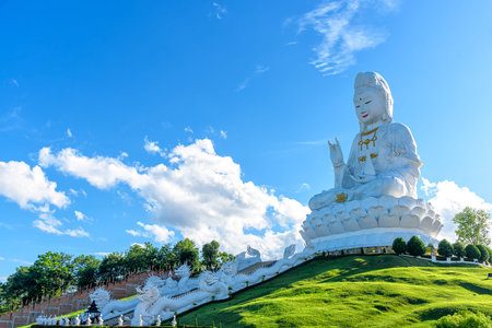 The large statue of Guan Yin at Huai Pla Kang Temple is Chinese style temple in Chiang Rai Province, Thailand. Is a famous tourist destination every year many tourists visit.の写真素材