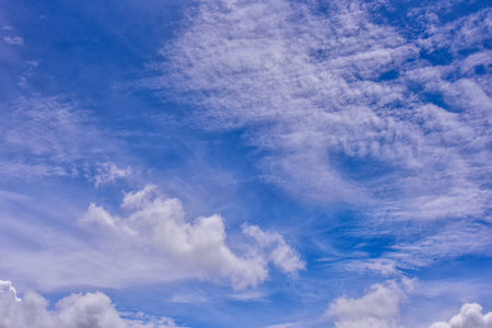 White clouds on blue sky background. Puffy fluffy white clouds blue sky.の写真素材