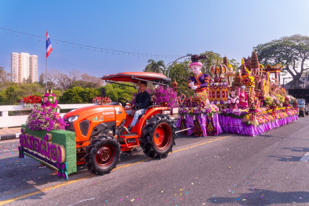 CHIANG MAI, THAILAND - FEBRUARY 04 , 2023  : A car decorated with fresh flowers in the parade of the 46th Chiang Mai Flower Festival moving through Nawarat Bridge Chiang Mai,Thailand.のeditorial素材