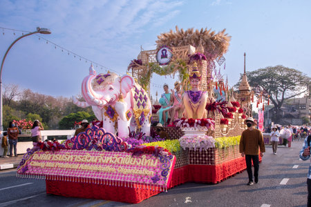 CHIANG MAI, THAILAND - FEBRUARY 04 , 2023  : A car decorated with fresh flowers in the parade of the...