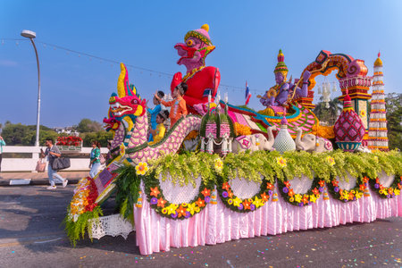 CHIANG MAI, THAILAND - FEBRUARY 04 , 2023  : A car decorated with fresh flowers in the parade of the...