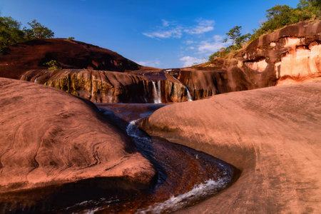 Tham Phra Waterfall or Tham Phra Phu Wua Waterfall located in Seka District, Bueng Kan Province, Thailand. There will be little water in the summer.の写真素材