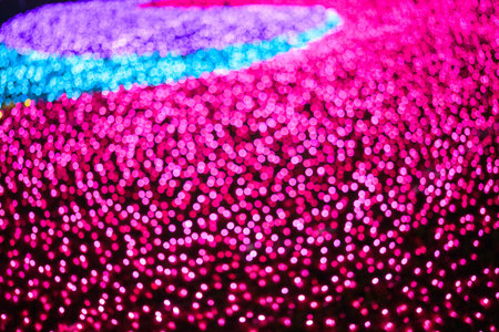 Colored decorative festive bokeh lights sparkle brightly. Abstract bokeh background.