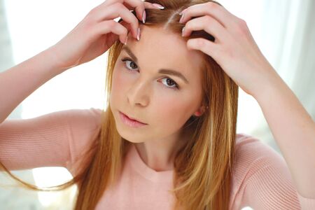 Hair problem. The woman has hair problems, to move.の写真素材