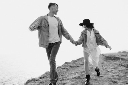Love couple. Beautiful man and woman in nature. Black and white photo.