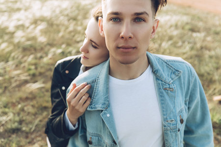 Young beautiful lovers. A man and a woman are resting in nature.の写真素材