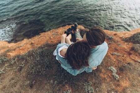 Young beautiful lovers. A man and a woman are resting in nature.の写真素材